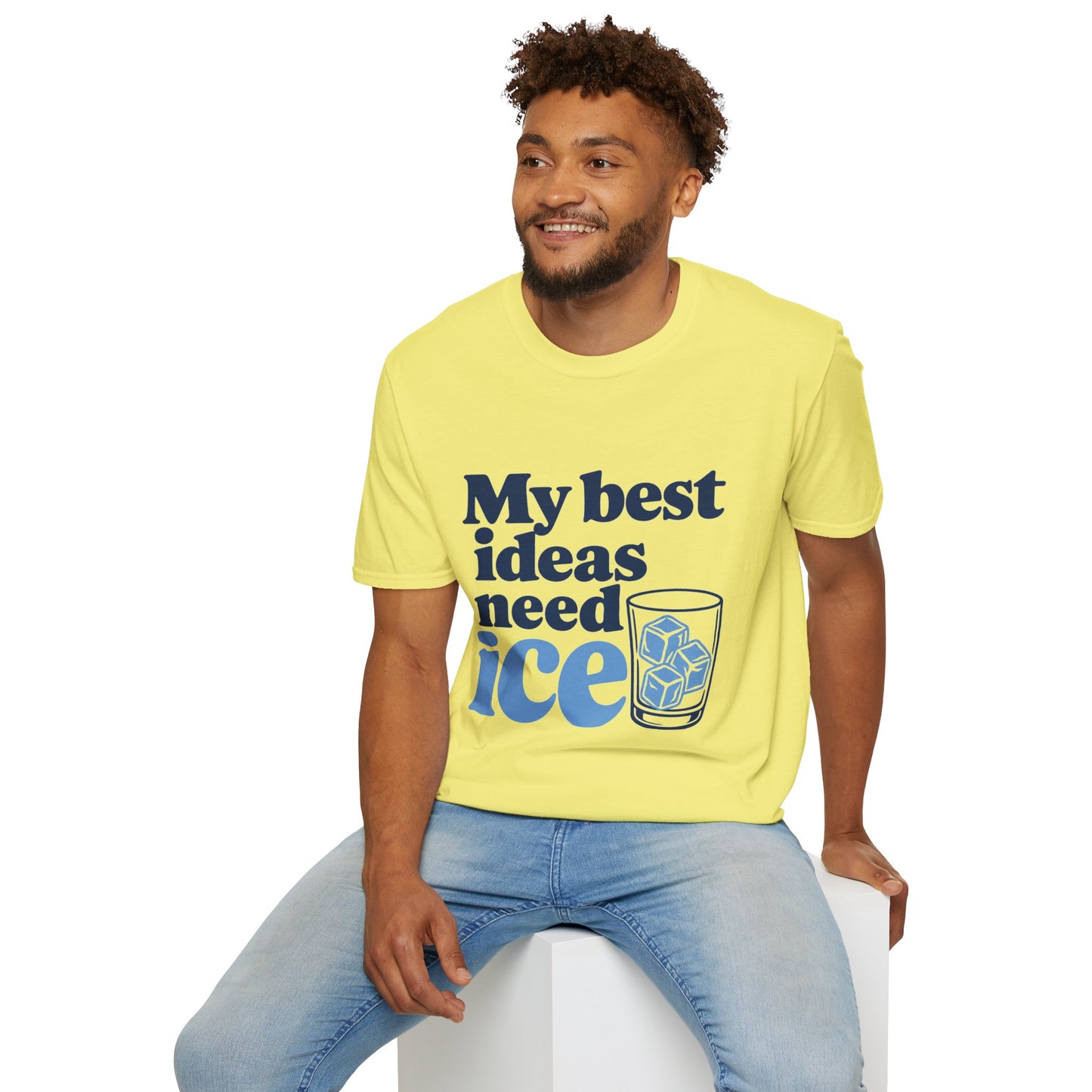 My Best Ideas Need Ice Shirt, Cornsilk pale yellow, worn by a model seated on a white block