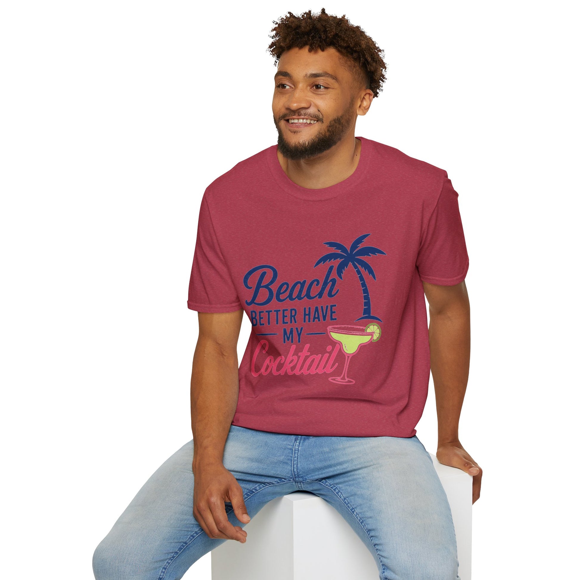 Beach Better Have My Cocktail Shirt, Heather Cardinal red, worn by a model seated on a white block