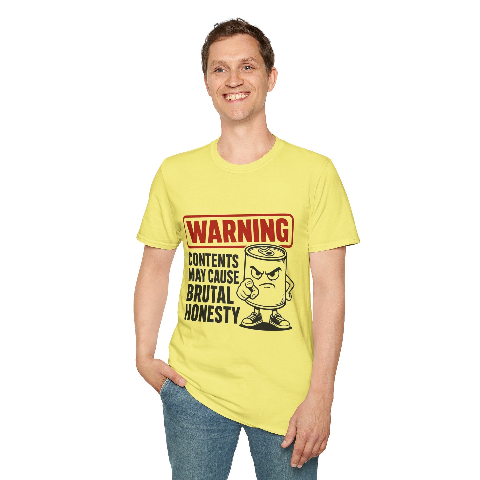 Warning: Contents May Cause Brutal Honesty Shirt, Cornsilk pale yellow, worn by a standing model with one hand in their pocket