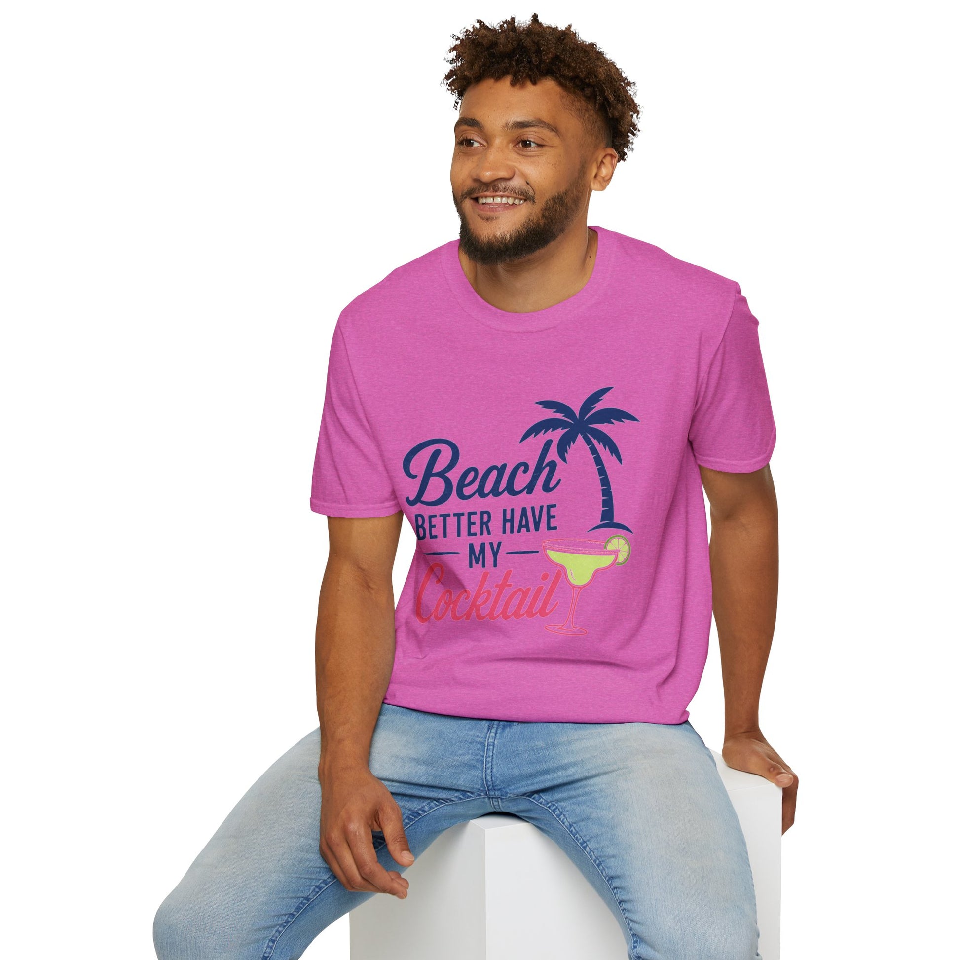 Beach Better Have My Cocktail Shirt, Heather Berry pink, worn by a model seated on a white block